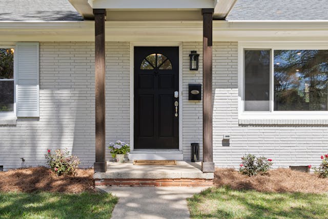 a%20clear%20pathway%20leading%20to%20a%20black%20front%20door a%20clear%20pathway%20leading%20to%20a%20black%20front%20door